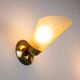 Set of three brass sconces with decorated yellow glass shades
