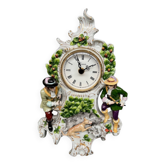 Sitzendorf. quartz mantel clock in a hunting style porcelain case.