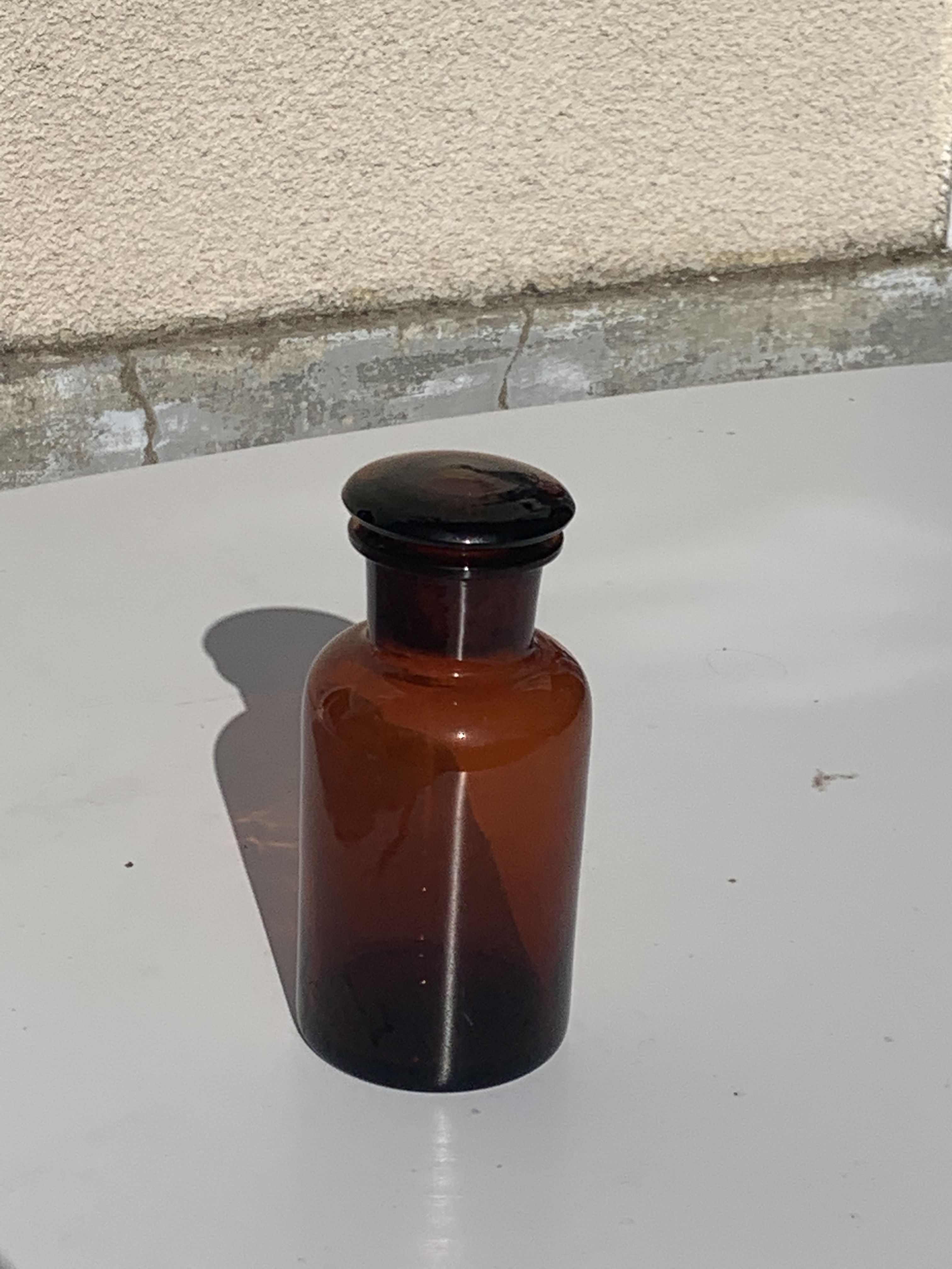 Jar bottle of herbalism pharmacy in amber colored glass art deco