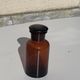 Jar bottle of herbalism pharmacy in amber colored glass art deco
