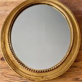 Antique gilded oval mirror
