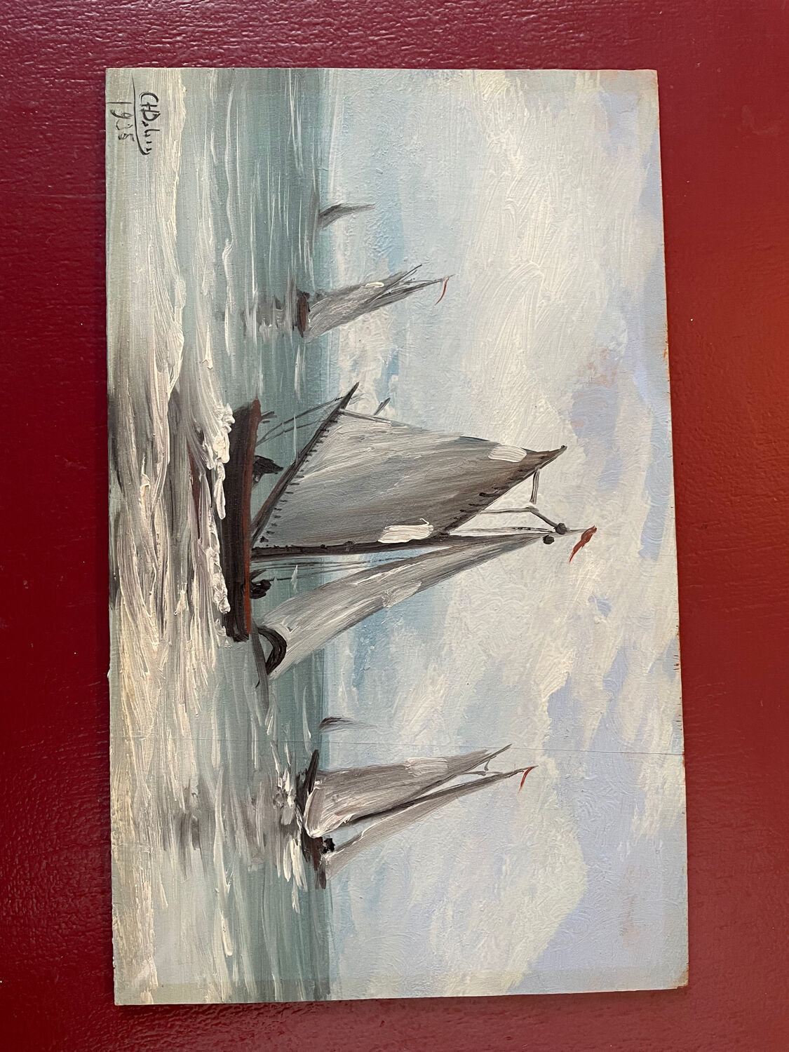 A pair of old paintings on wood.