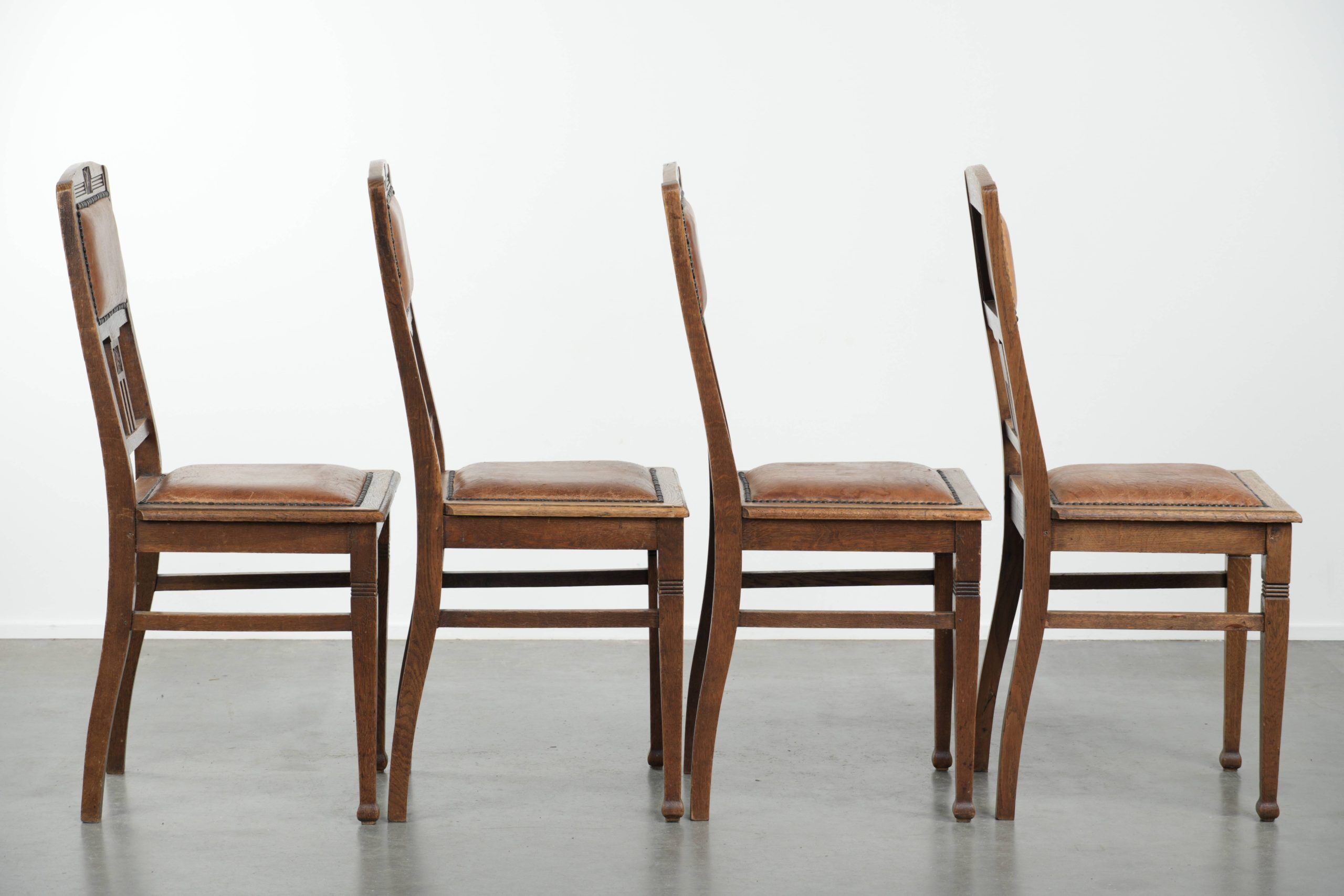 Set of 4 antique oak dining chairs in Art Nouveau style with sheepskin