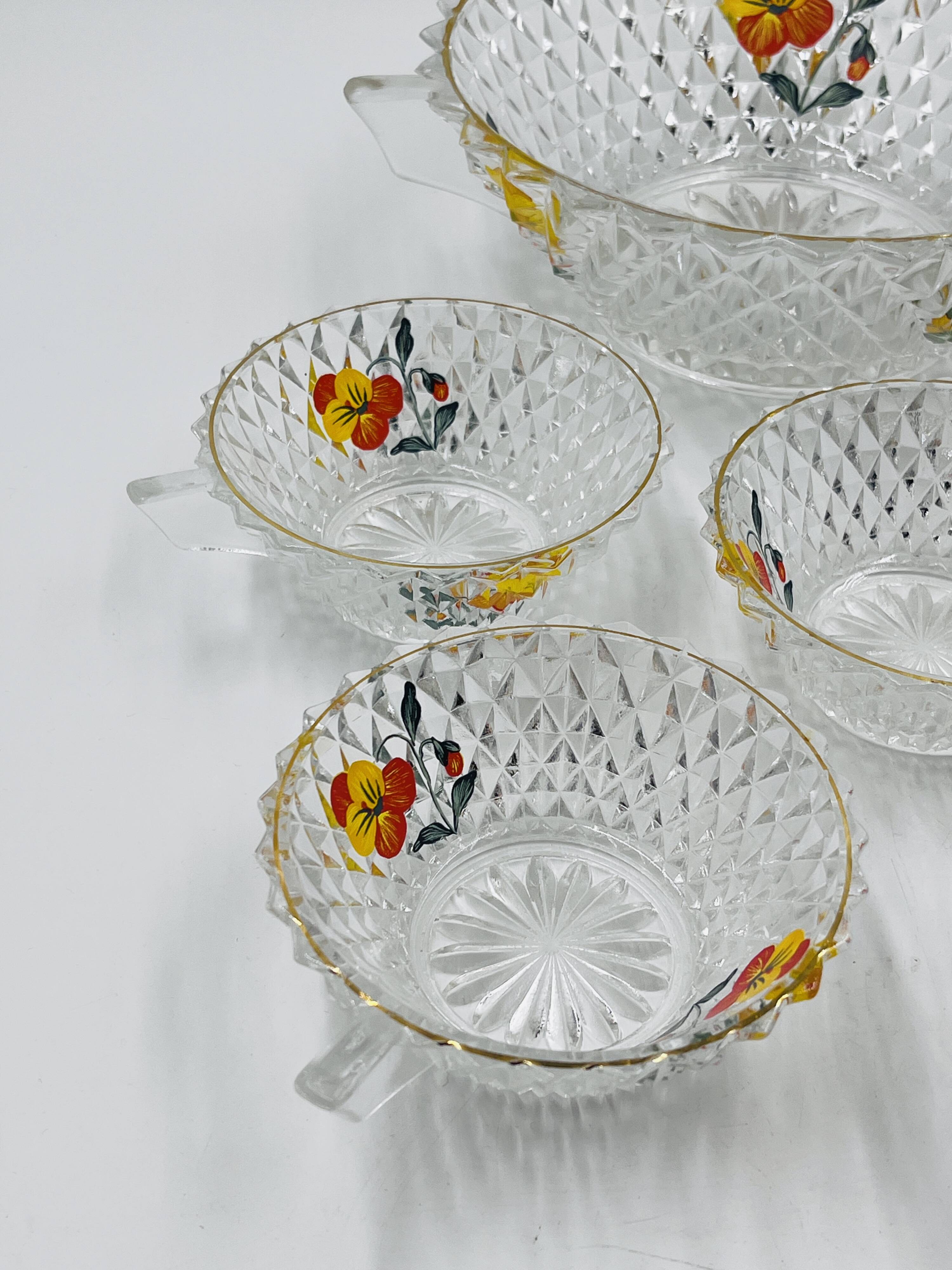 Vintage glass fruit salad serving set with a pansy design.