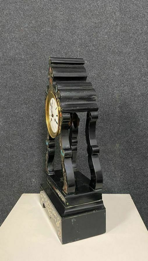 Portico clock of eventful shape of napoleon III period blackened wood inlaid with brass