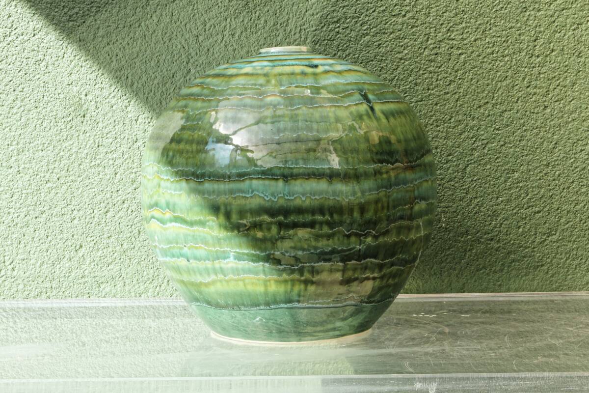 Glazed ceramic ball lamp base, green gradients.