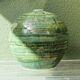 Glazed ceramic ball lamp base, green gradients.