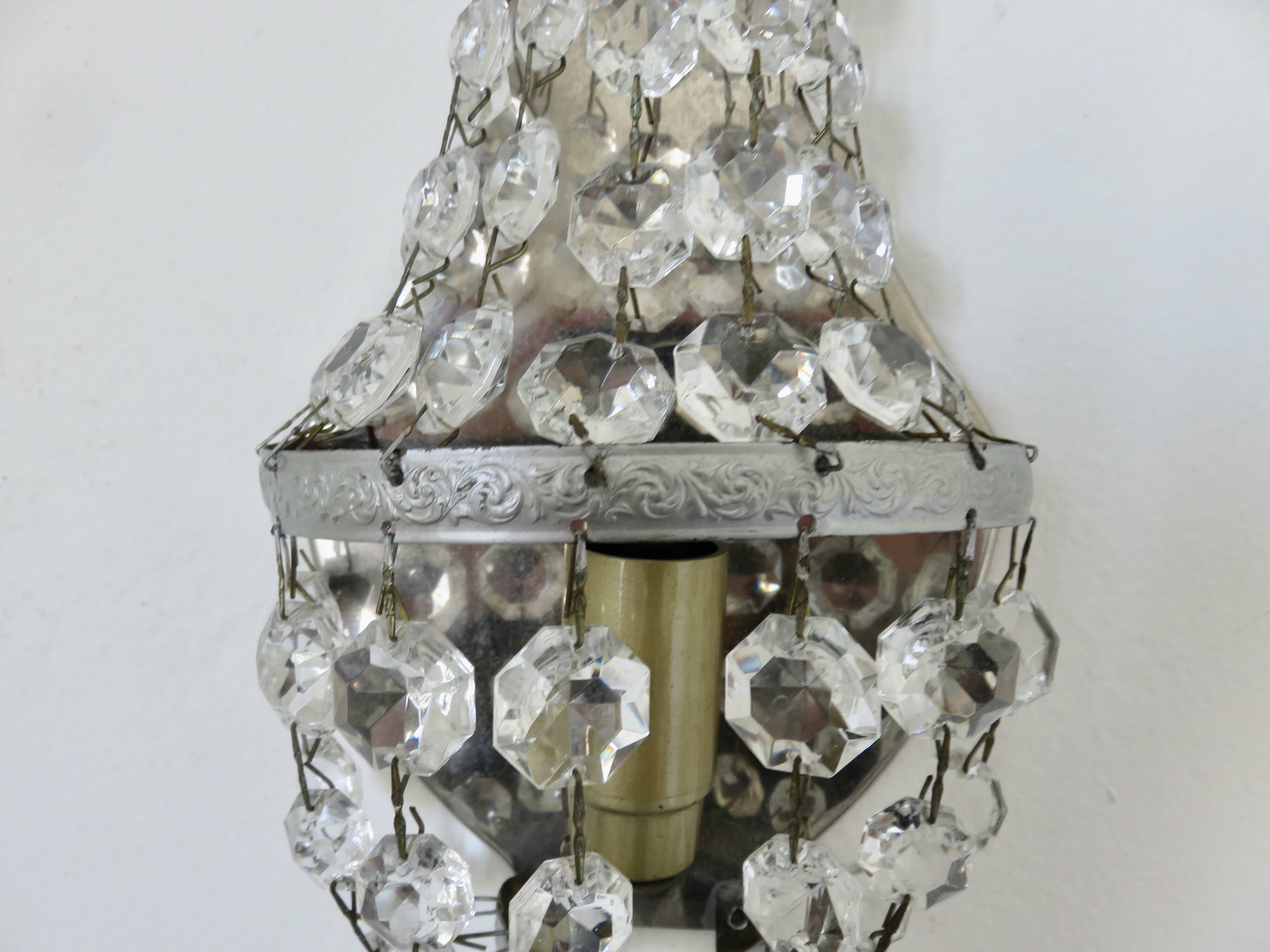 Pair of silver-plated balloon wall lights with pendants, circa 1970.