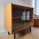 Low buffet or wooden display cabinet with sliding door - 1950s design