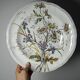 Antique Longchamp shallow dish with polychrome daisies in ironstone.
