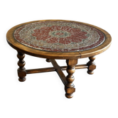 Table basse vintage en bois tourné et cuir à décor astrologique