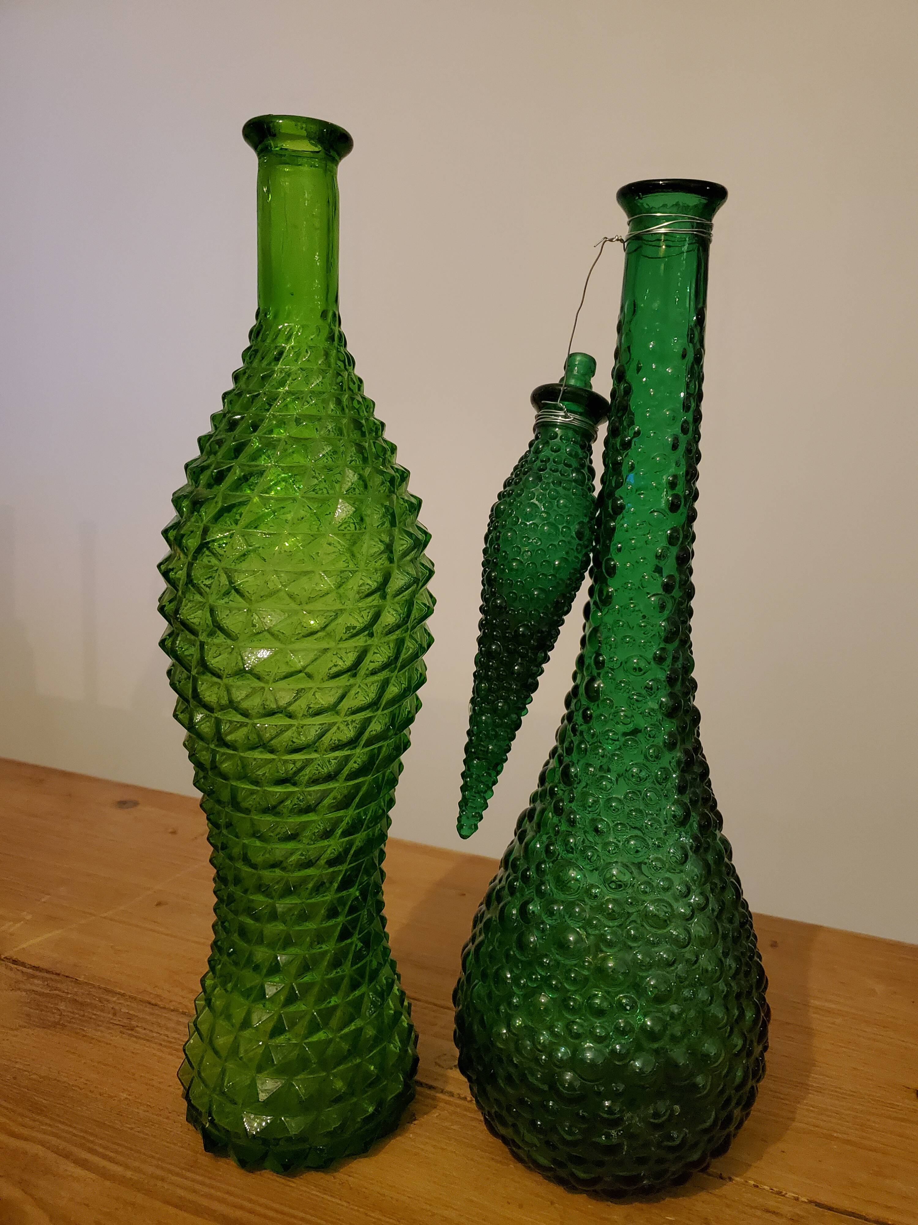 Set of green bubble glass bottles