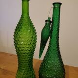 Set of green bubble glass bottles
