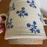 Old pot, sandstone, blue flower decoration