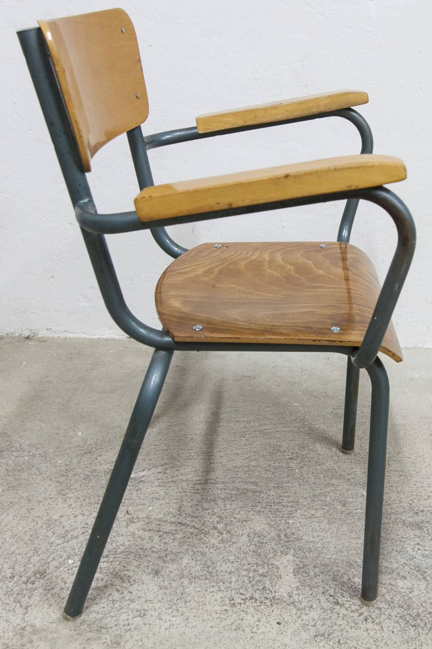 1962 school teacher's chair in honey color and tubular structure