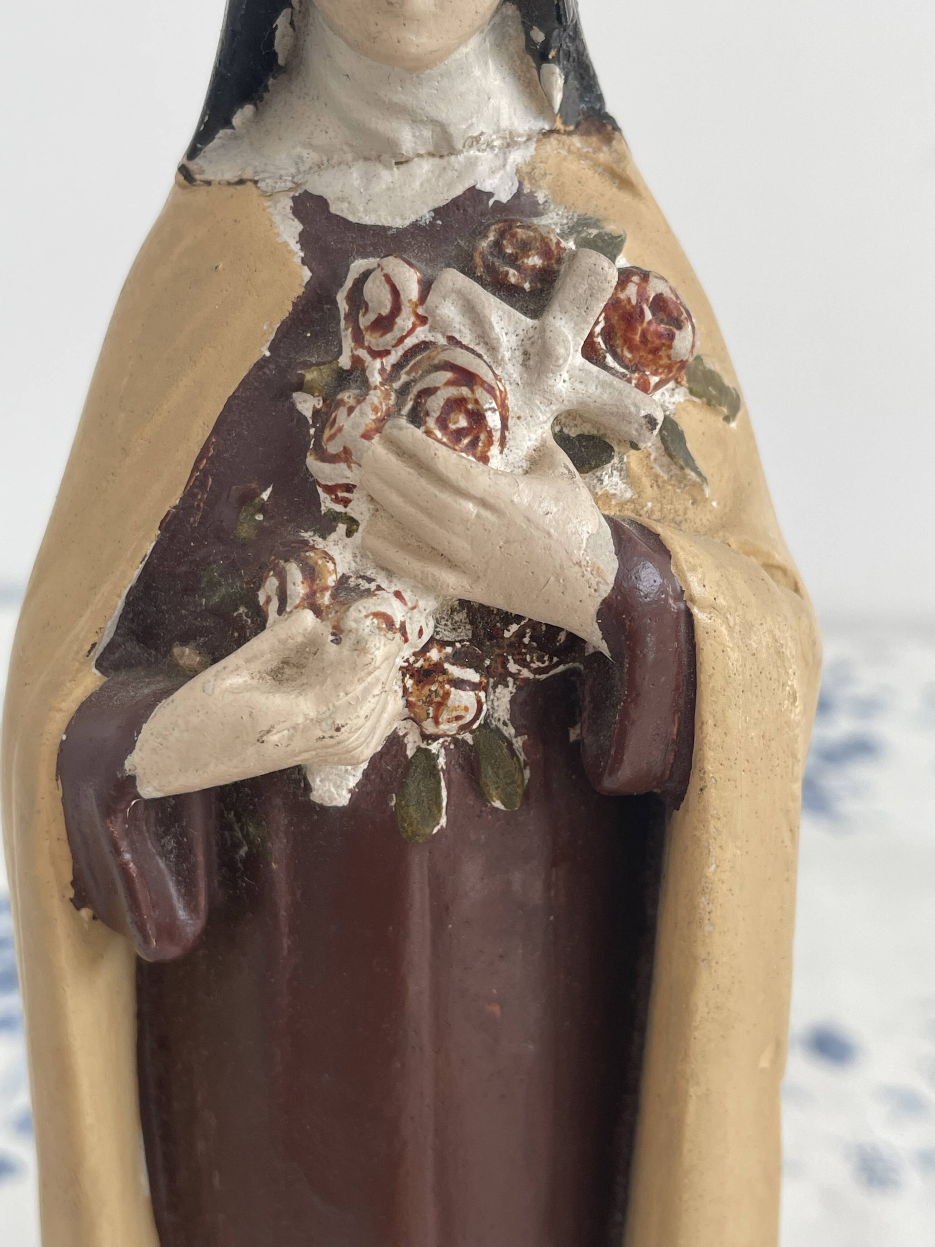 Antique statue of Saint Therese of Lisieux, religious plaster figurine