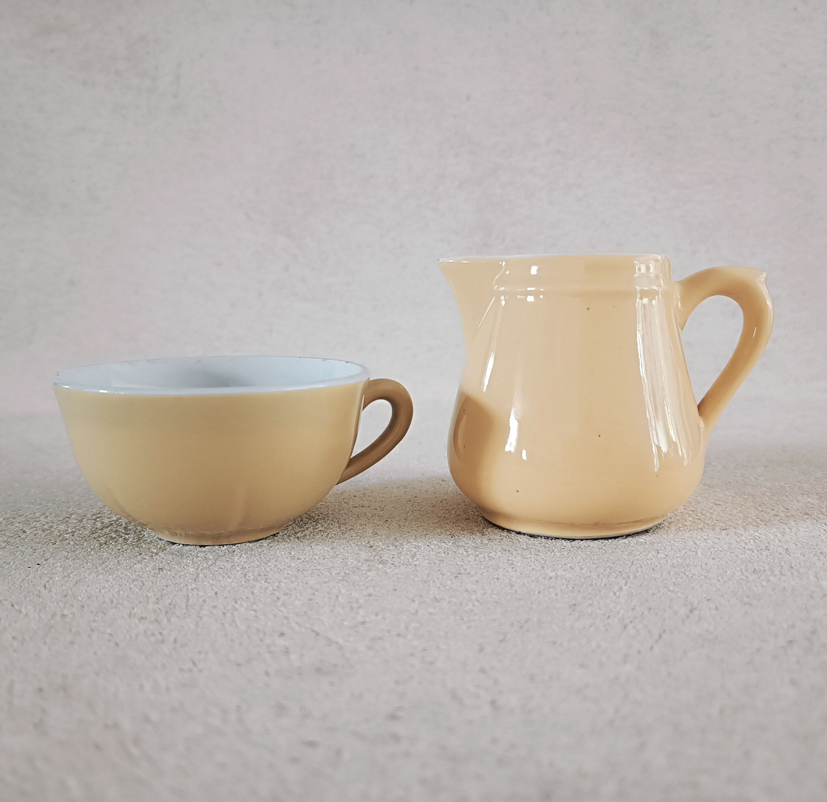 Earthenware cup and milk jar