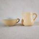 Earthenware cup and milk jar