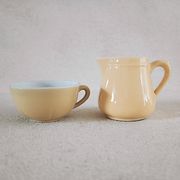 Earthenware cup and milk jar