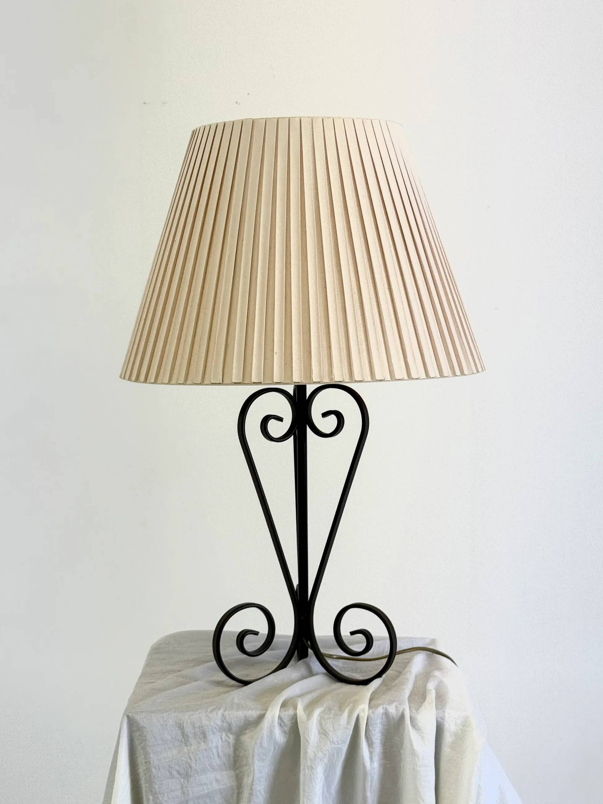 Vintage wrought iron table lamp in swirl shape with pleated shade