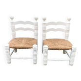 Pair of vintage straw-seated chairs by Charles Dudouyt.