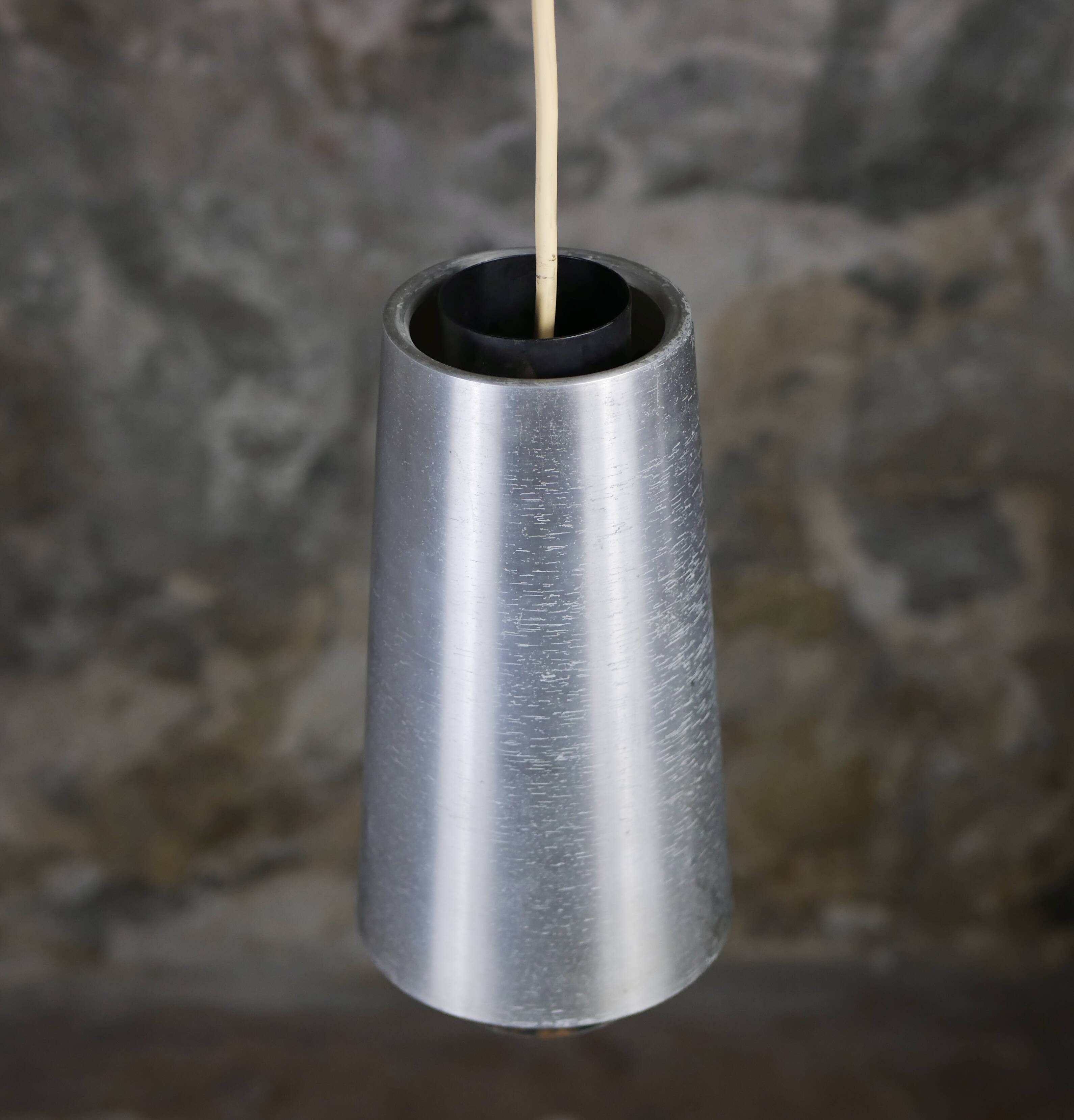 Trio of Raak steel pendant lights, 1960s