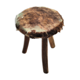 Rustic tripod stool seat covered with goatskin