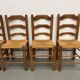 Set of 8 chairs in solid elm with straw seats.
