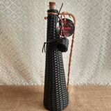 Glass bottle covered with black scoubidou with twisted golden handle - vintage
