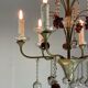 Silver bronze lustre garnished with pampilles, fruits and balls