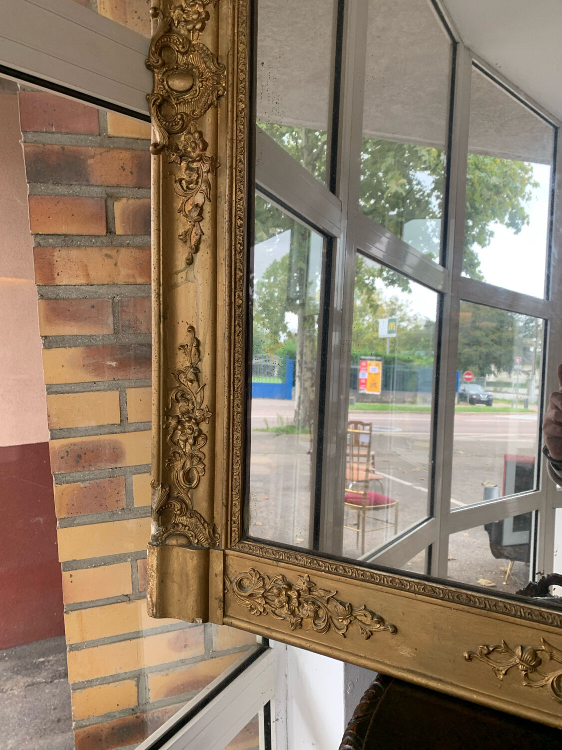 Old gilded mirror fireplace, 19th century restoration