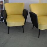 Pair of vintage 1950s cocktail chairs in yellow velvet and black faux leather, wooden frame.
