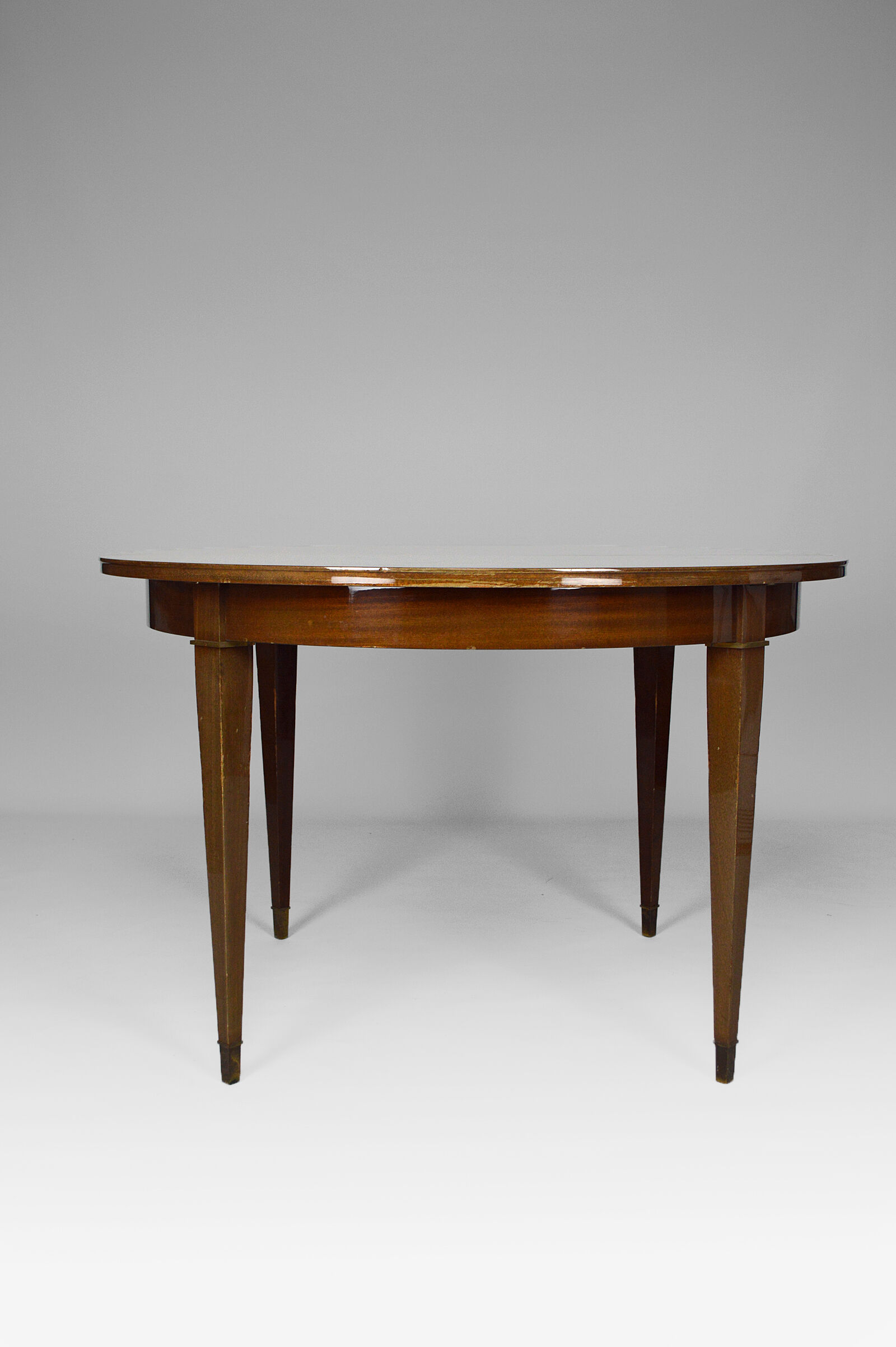 Art Deco mahogany round table by Jacques Adnet around 1940
