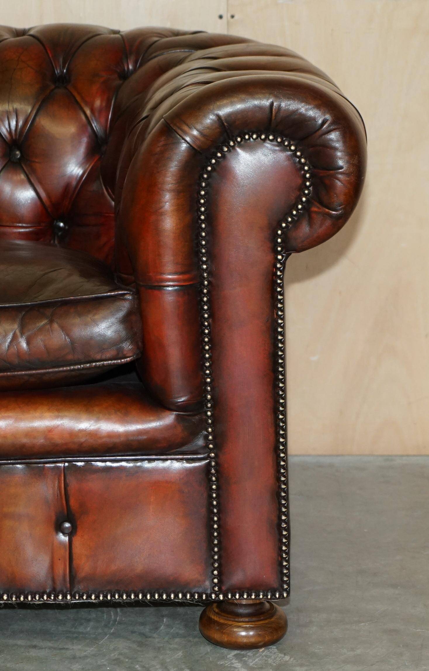 Pair of restored antique Chesterfield sofas in Boudreaux leather.