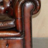 Pair of restored antique Chesterfield sofas in Boudreaux leather.
