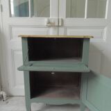 Meuble vintage en vert fumé, plateau bois.