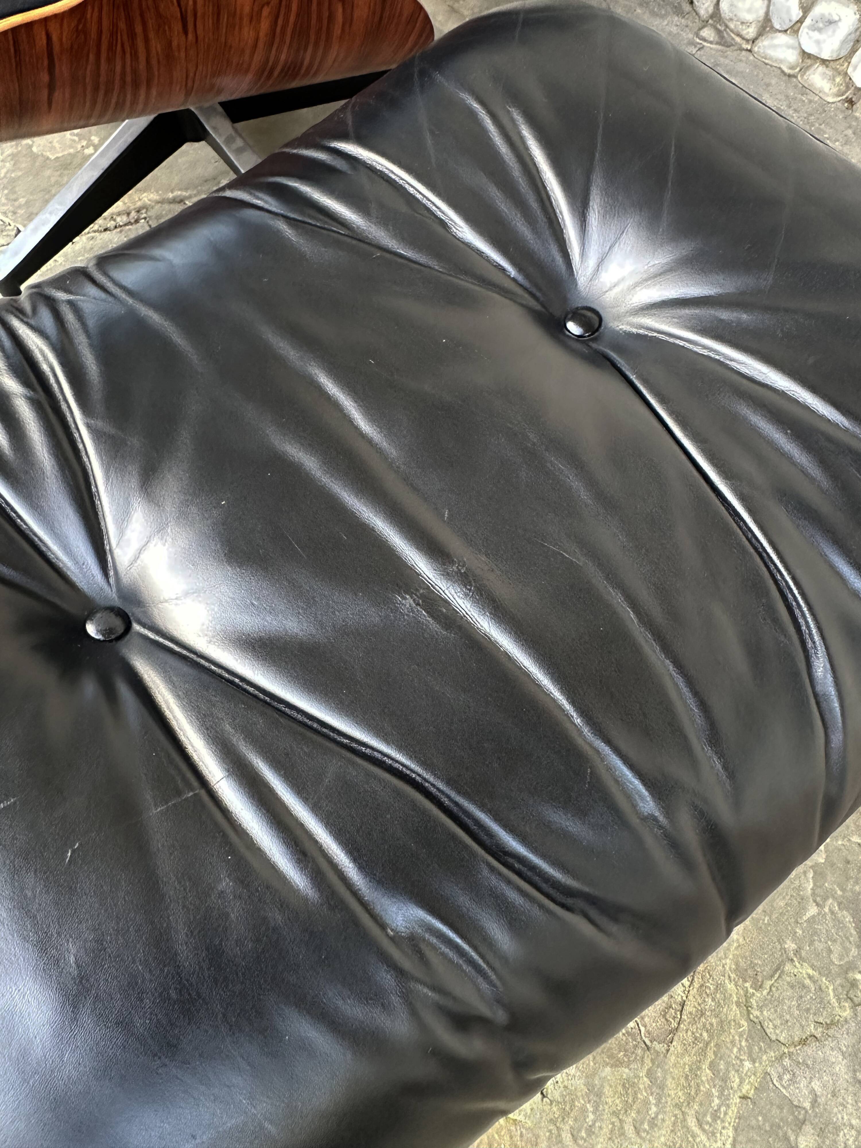 Fauteuil Lounge et ottoman Herman Miller Charles & Ray Eames, palissandre