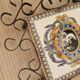 Hand painted gien tile on wrought iron trivet