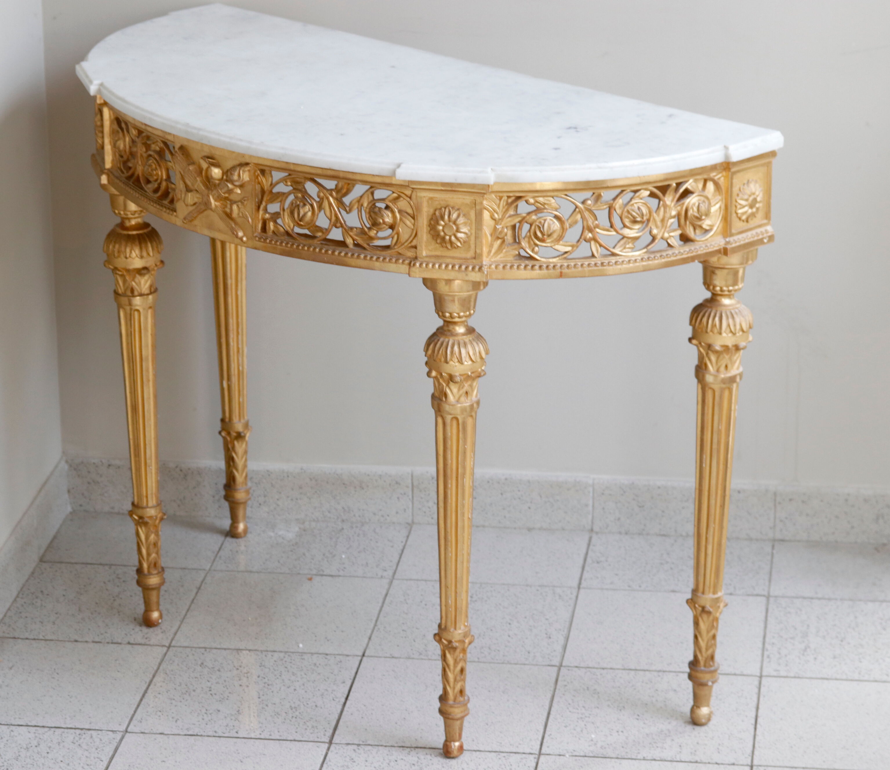 Louis XVI-style gilded wooden console, half-moon in shape