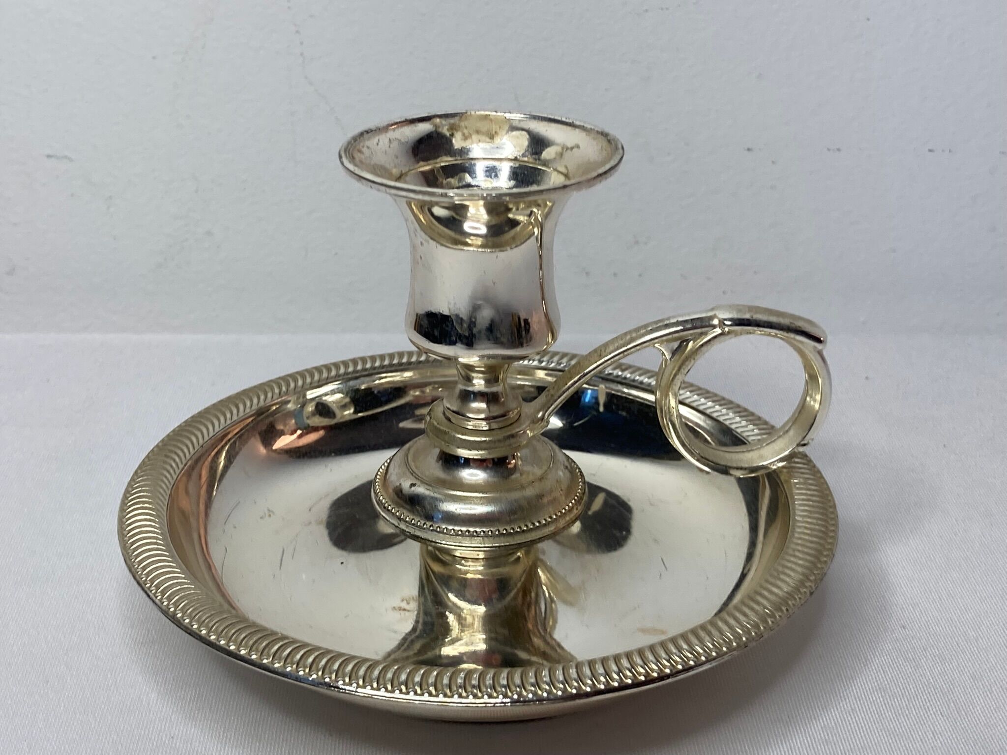 Twentieth century silver metal hand candle holder