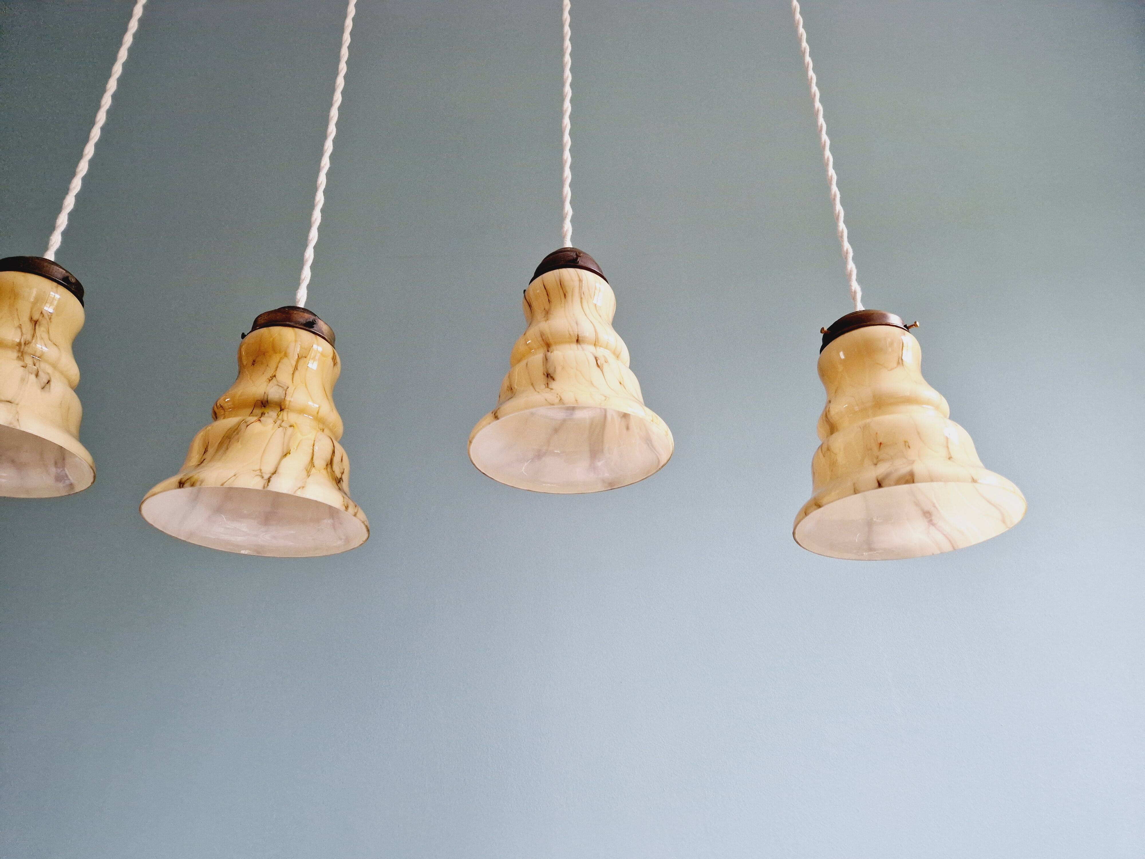 Set of 3 Art Deco marbled opaline pendant lights, 1920s-30s