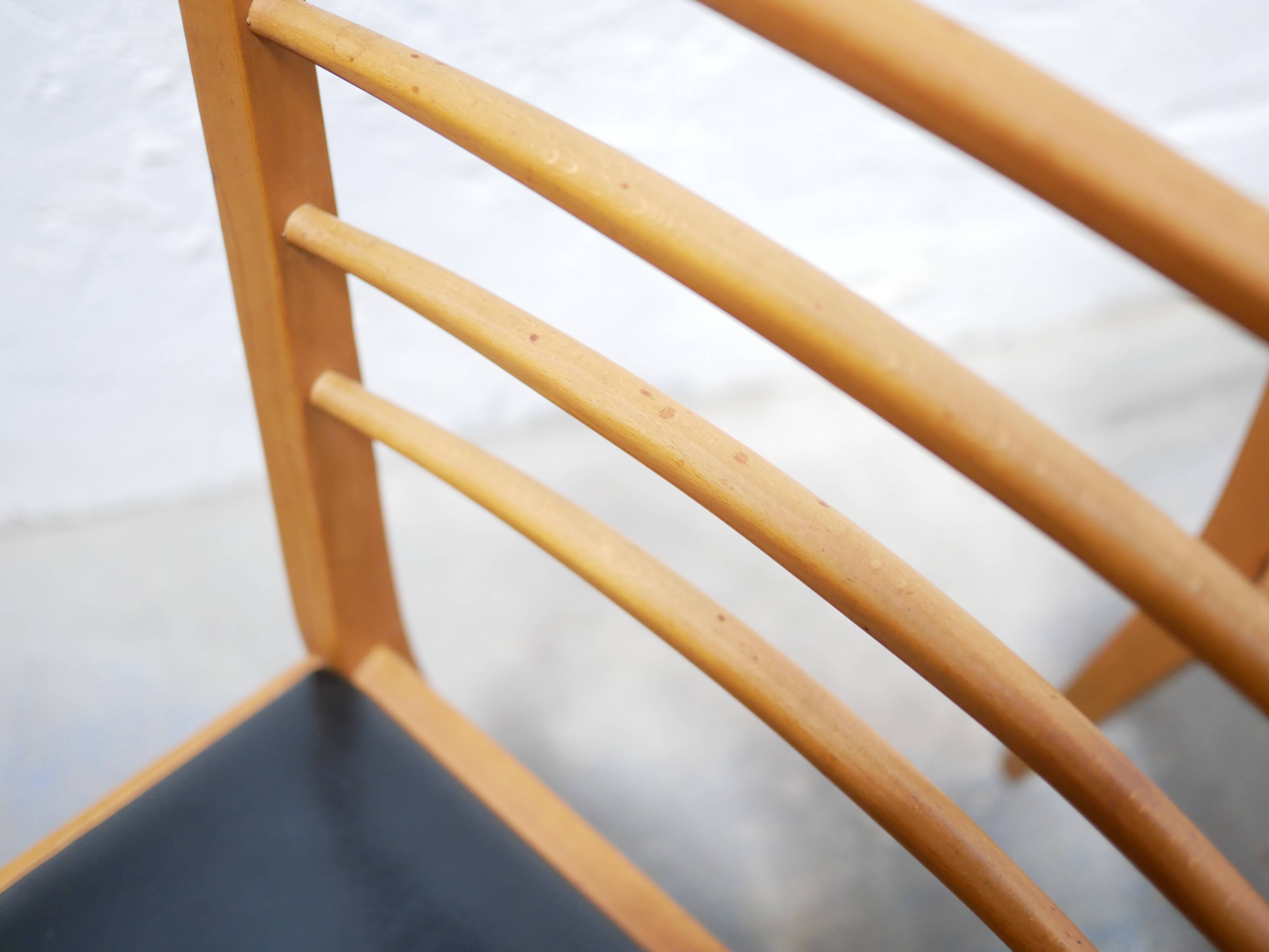 Series of 4 vintage chairs in wood and skaï