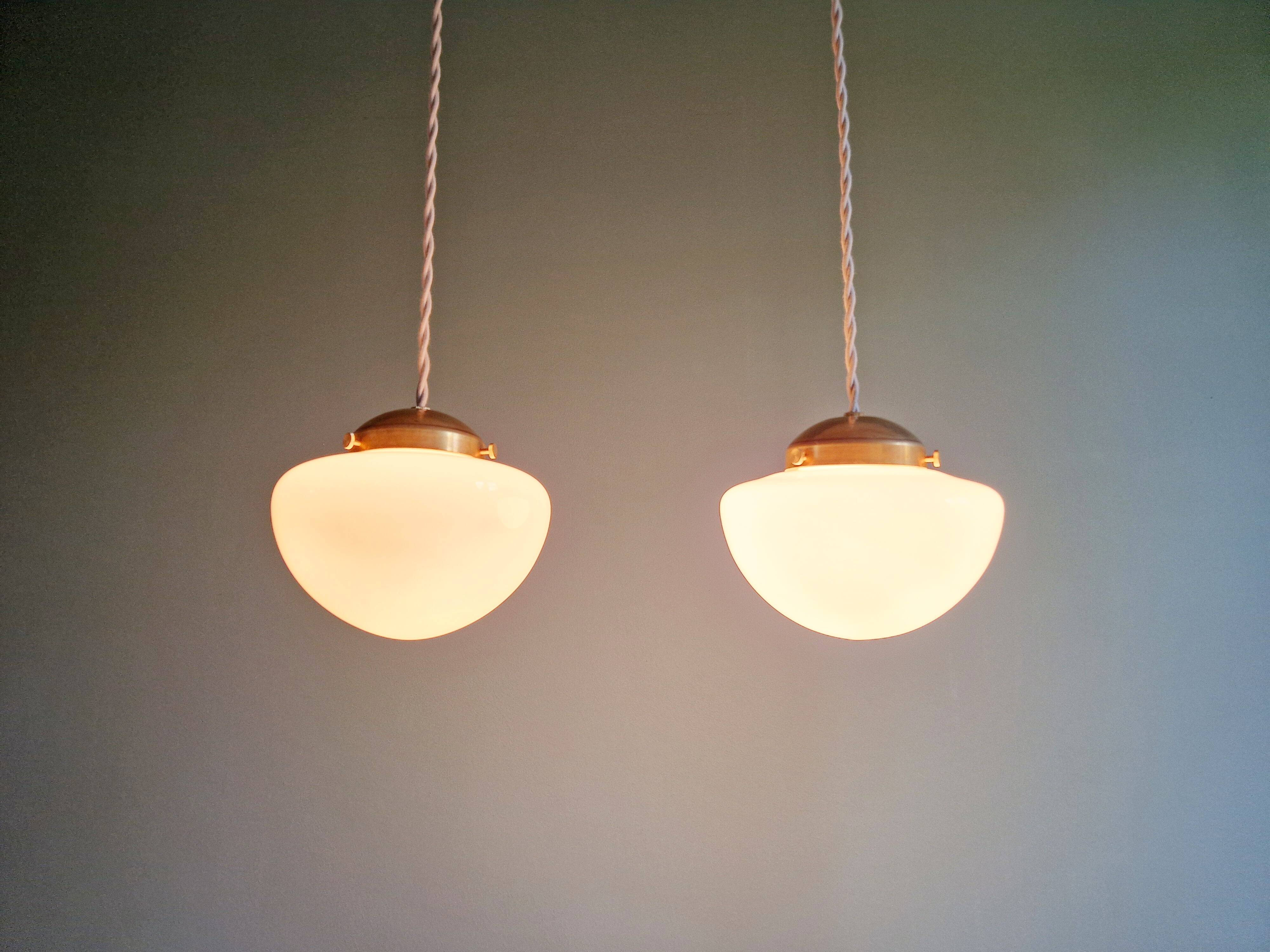 Duo of Art Deco suspensions in white opaline, 1920s-30s