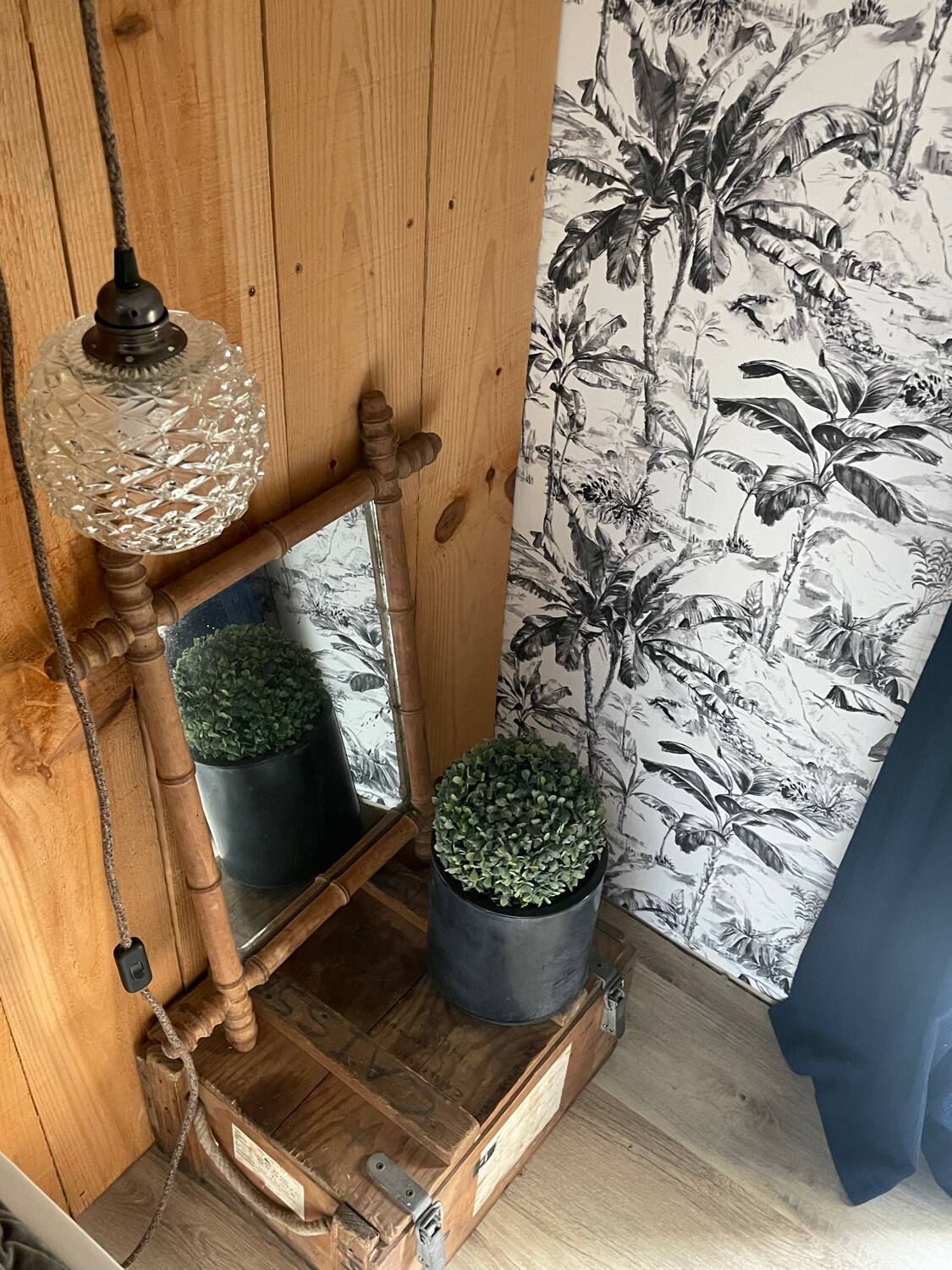 Carved wooden mirror in a bamboo style