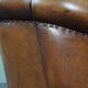 Club armchair in sheepskin with black piping
