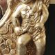 Miroir rond à décor de putti et floral