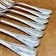7 Christofle silver-plated oyster forks with Louis crossed ribbons