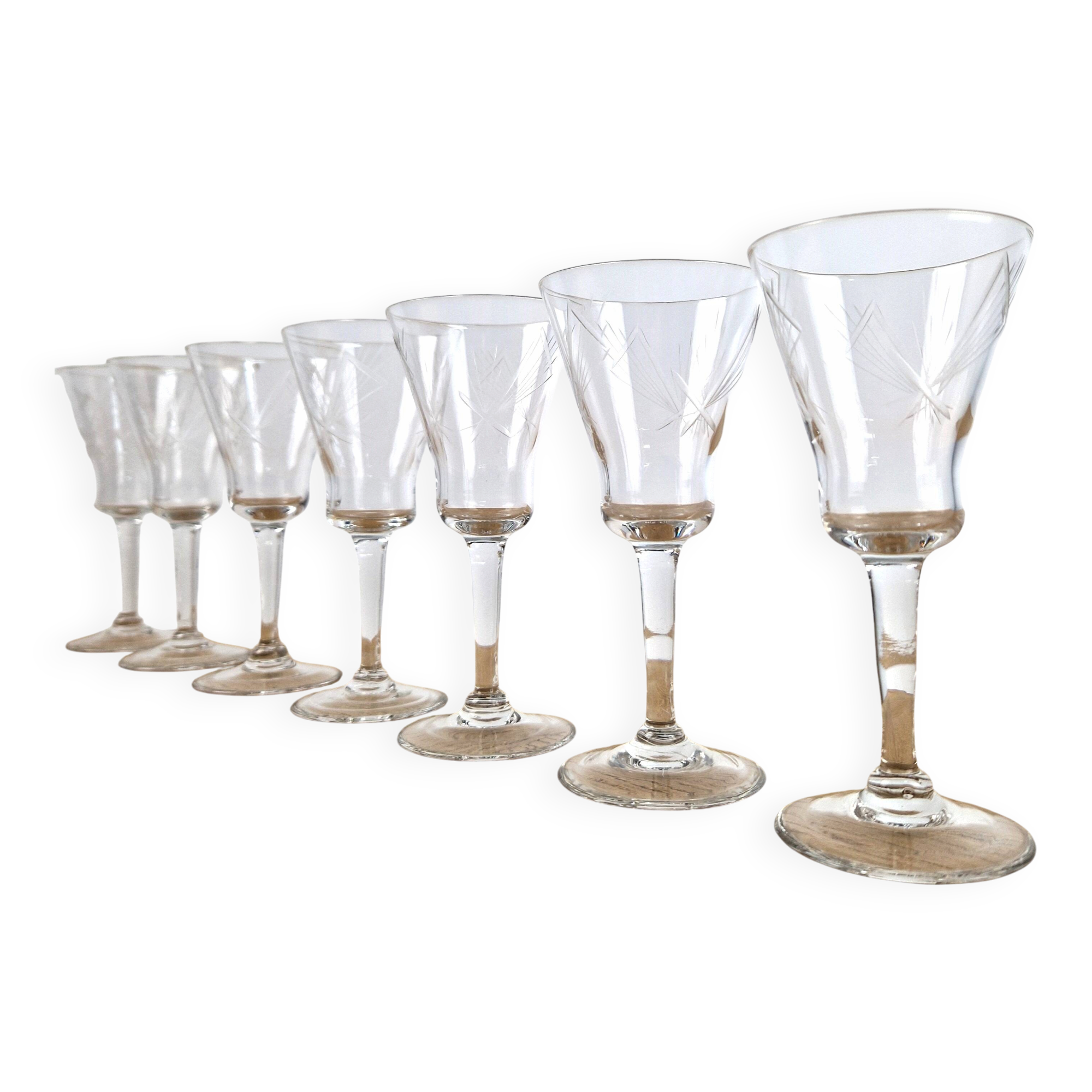 7 crystal footed glasses, antique white wine glasses.