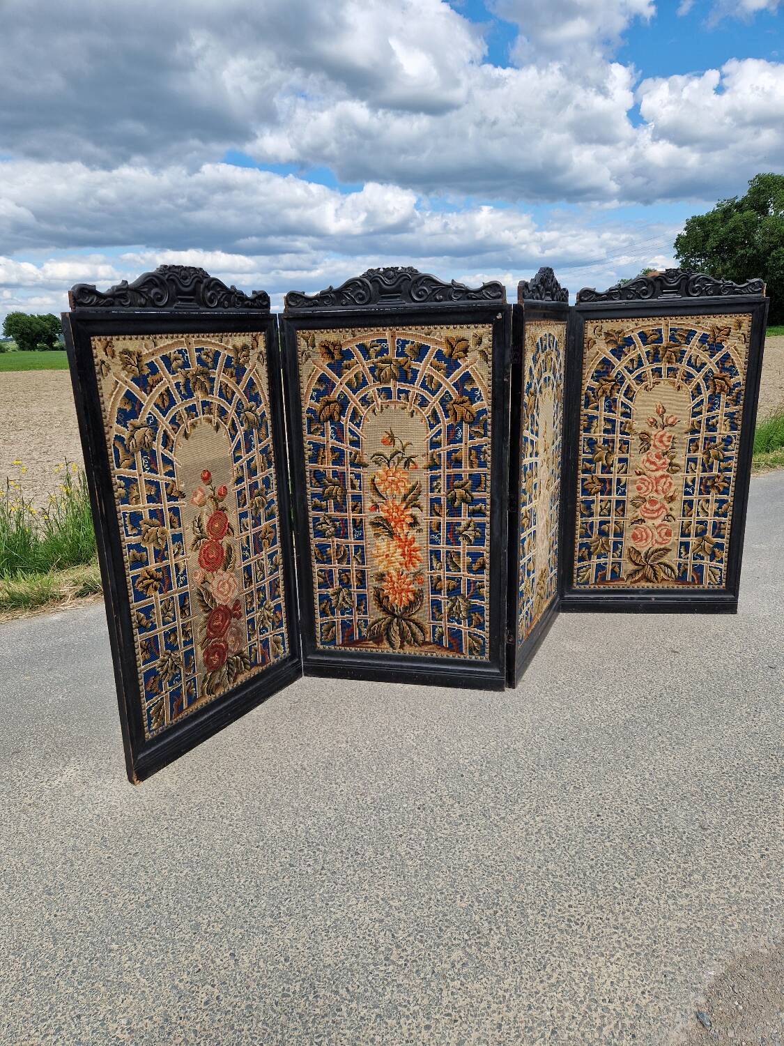Folding screen in black-painted wood, 19th century
