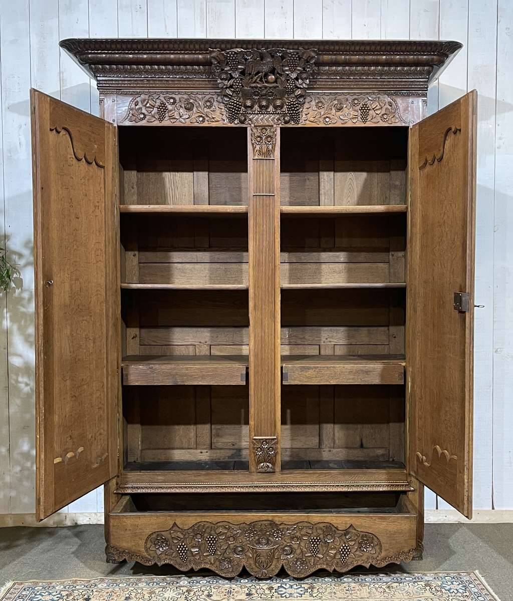 19th-century Norman wedding armoire in blonde oak.